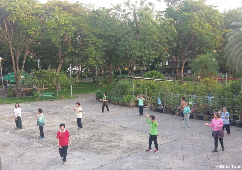 group of women exercising at Rommaninat Park in the morning